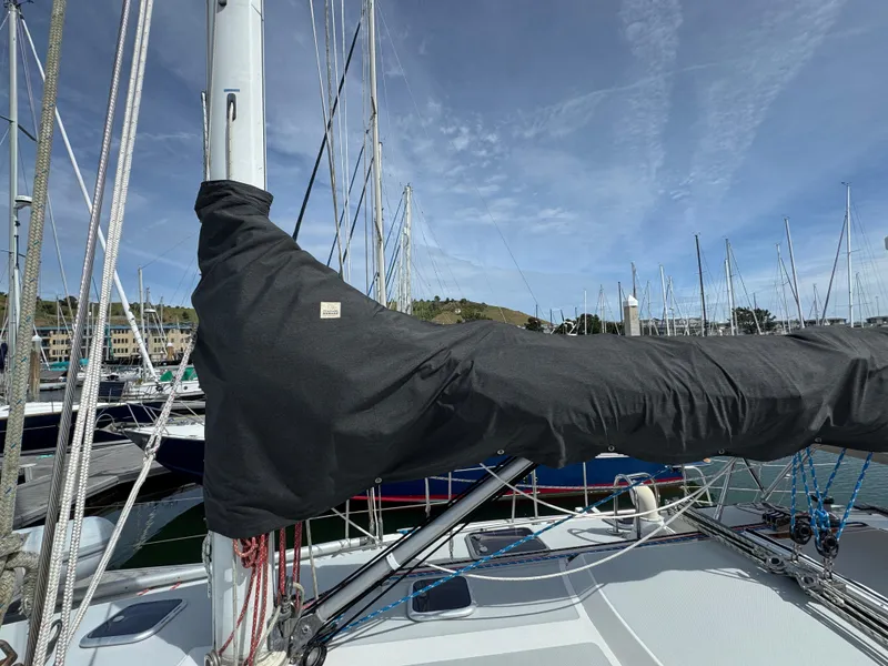 Slide: The Image of Sailboat mast and boom cover on a 1993 Catalina 42 in a marina. - 6