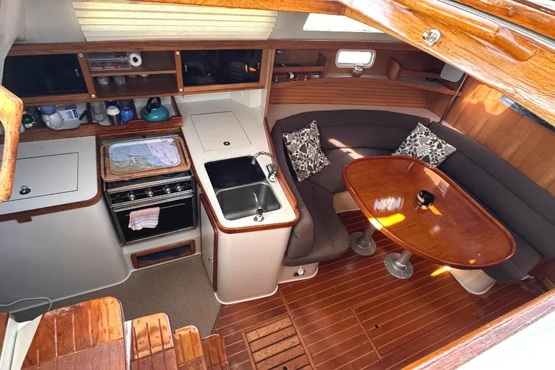 Slide: The Image of Interior of a 1993 Catalina 42 sailboat with kitchen and dining area. - 7