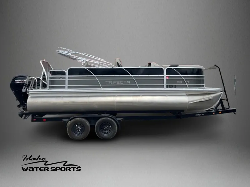 Slide: The Image of 2022 Trifecta 22 LE Rear Fish pontoon boat on trailer, Idaho Water Sports. - 1