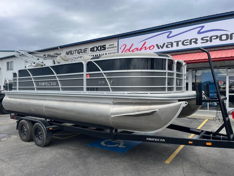 Slide: The Image of 2022 Trifecta 22 LE Rear Fish pontoon boat on trailer at Idaho Water Sports. - 10