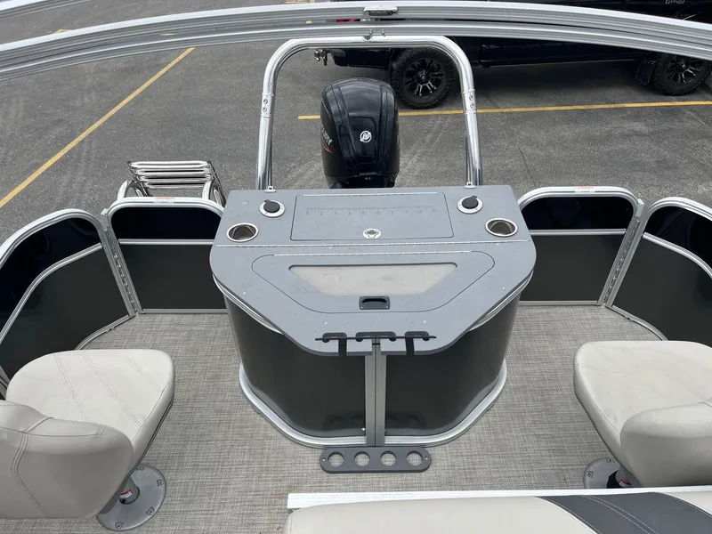 Slide: The Image of 2022 Trifecta 22 LE Rear Fish boat interior with seating and control panel. - 12