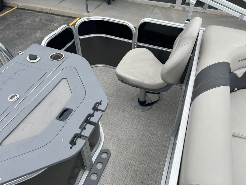 Slide: The Image of 2022 Trifecta 22 LE Rear Fish boat interior with seating and fishing station. - 13