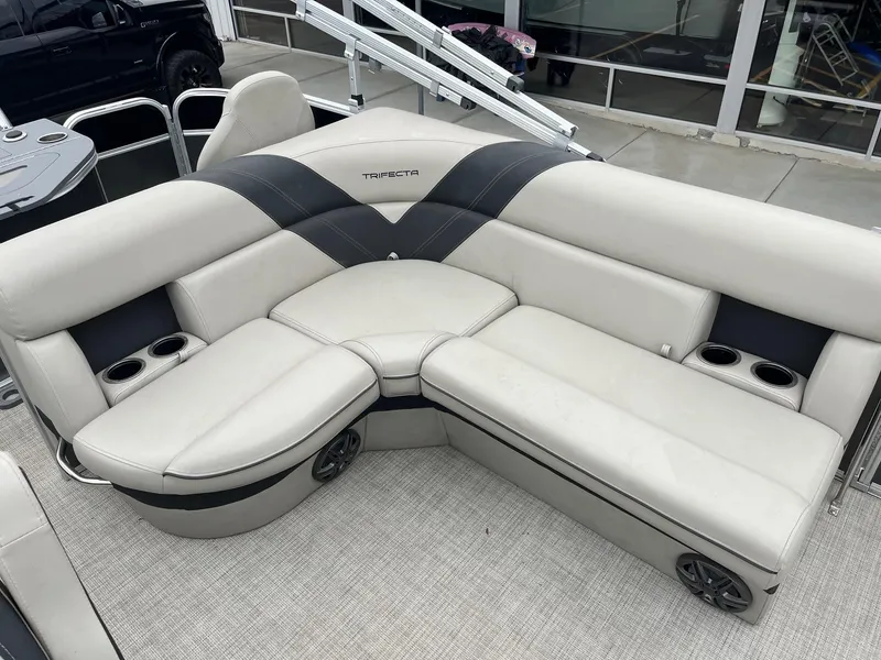 Slide: The Image of 2022 Trifecta 22 LE Rear Fish boat seating with cup holders and sleek design. - 16