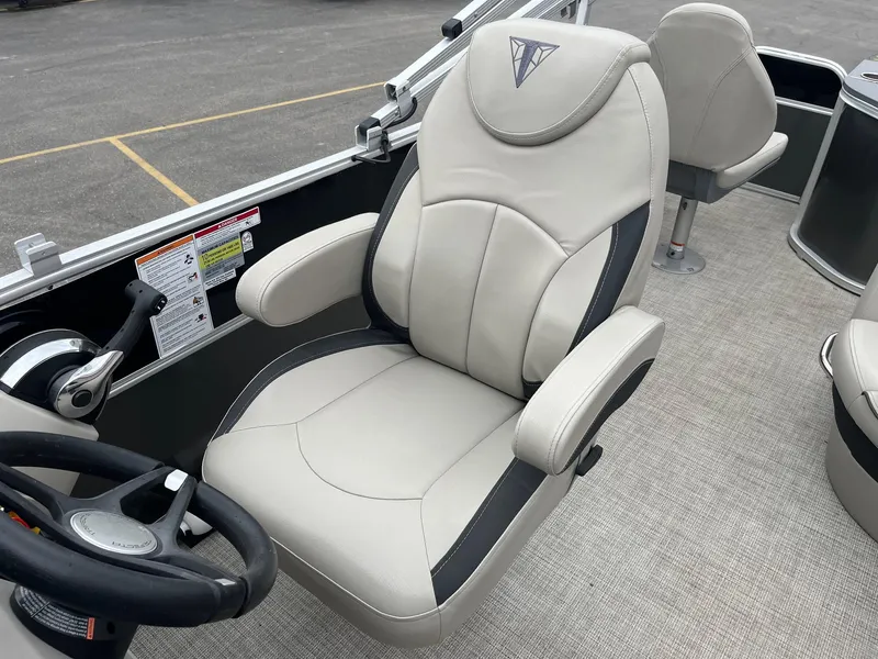 Slide: The Image of Captain's chair in 2022 Trifecta 22 LE Rear Fish boat, featuring sleek design and comfortable seating. - 18