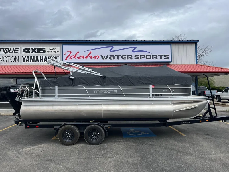 Slide: The Image of 2022 Trifecta 22 LE Rear Fish pontoon boat at Idaho Water Sports dealership. - 2