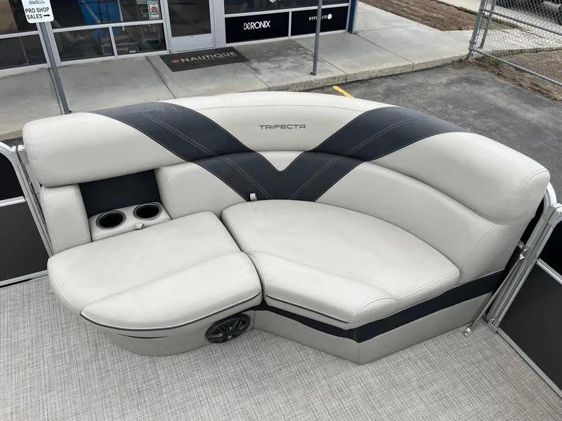 Slide: The Image of 2022 Trifecta 22 LE Rear Fish boat seating with cup holders and sleek design. - 21