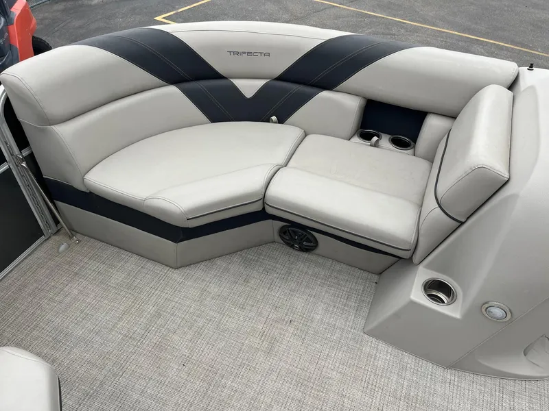 Slide: The Image of Luxurious seating on 2022 Trifecta 22 LE Rear Fish boat with cup holders. - 22