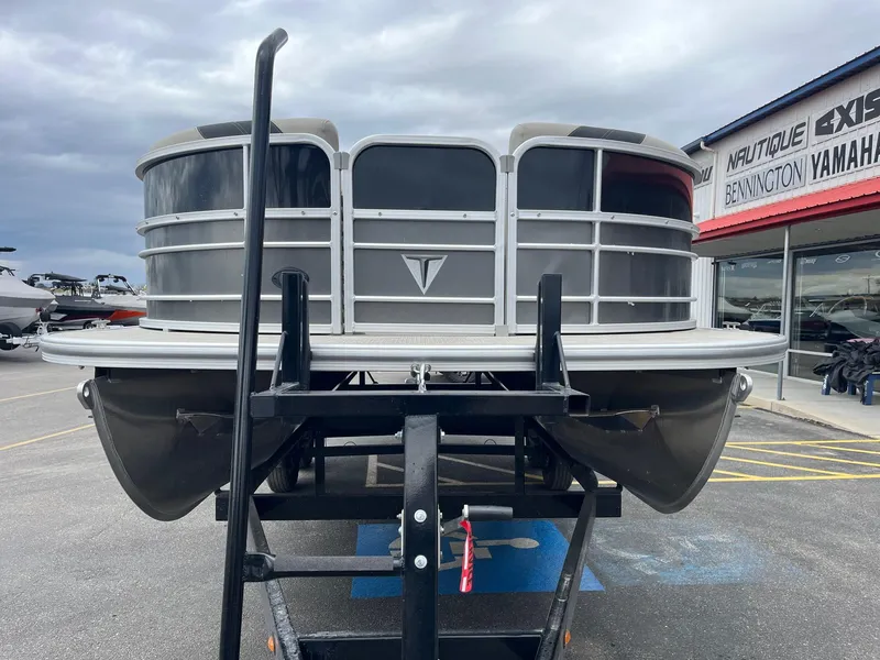 Slide: The Image of 2022 Trifecta 22 LE Rear Fish pontoon boat on trailer at dealership. - 9