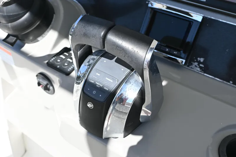 Slide: The Image of Throttle control of 2014 Boston Whaler 270 Dauntless boat, featuring sleek design and modern technology. - 17