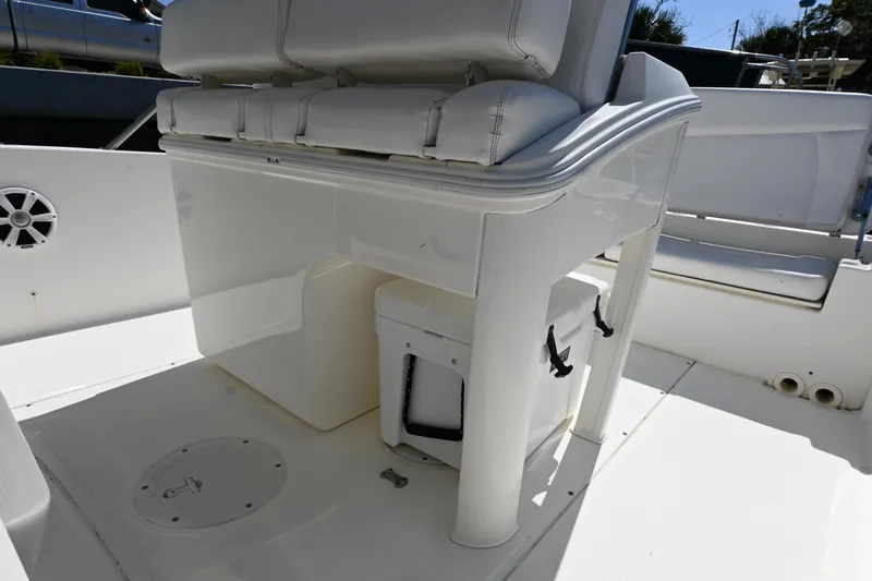 Slide: The Image of 2014 Boston Whaler 270 Dauntless boat interior with seating and storage. - 20