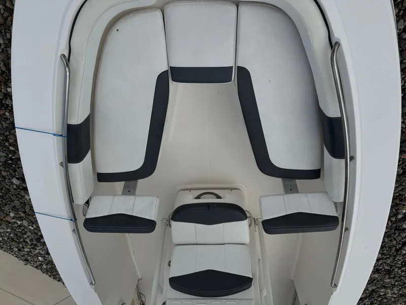 Slide: The Image of 2018 Robalo R200 Center Console boat interior with cushioned seating and sleek design. - 5