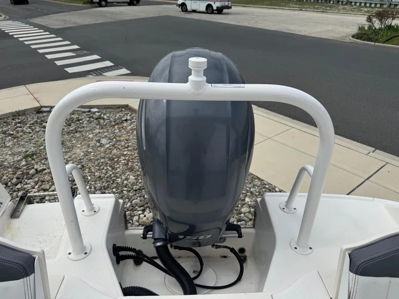 Slide: The Image of 2018 Robalo R200 Center Console boat engine view at a dockside location. - 9