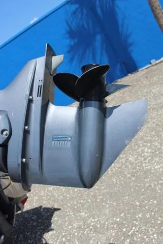 Slide: The Image of Close-up of a 2018 Apex Marine 820 VX Cruise boat propeller against a blue wall. - 12