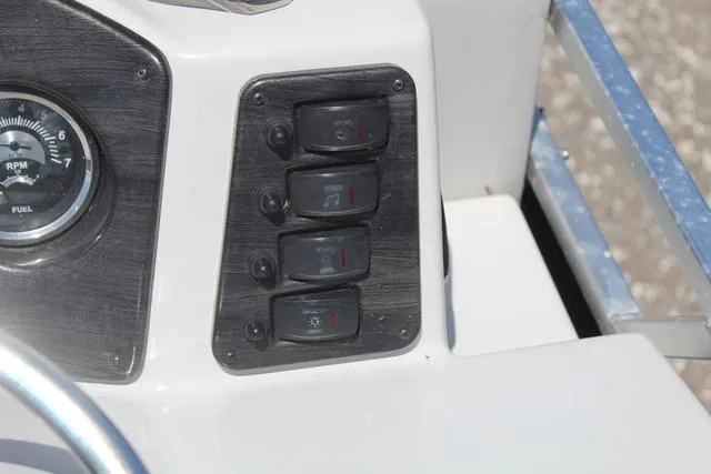 Slide: The Image of Control panel of 2018 Apex Marine 820 VX Cruise boat with switches and gauge. - 21