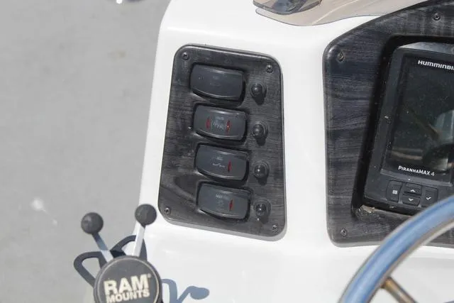 Slide: The Image of Control panel of 2018 Apex Marine 820 VX Cruise with switches and Humminbird PiranhaMAX 4. - 22