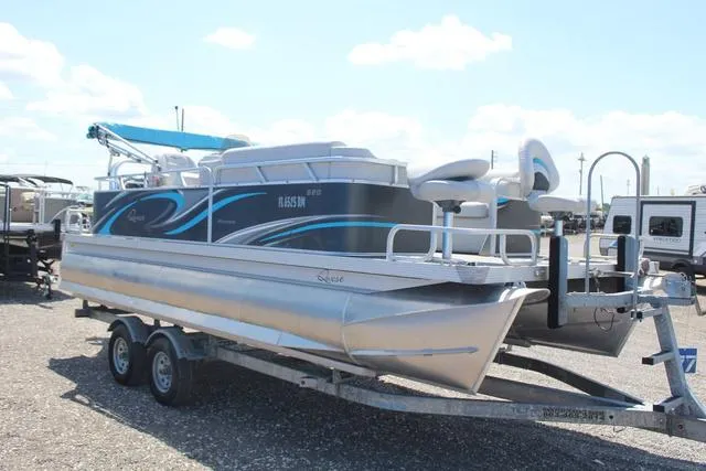 Slide: The Image of 2018 Apex Marine 820 VX Cruise pontoon boat on a trailer, parked outdoors. - 3