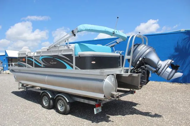 Slide: The Image of 2018 Apex Marine 820 VX Cruise pontoon boat on trailer, blue canopy, outboard motor. - 6