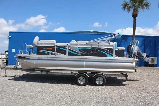 Slide: The Image of 2018 Apex Marine 820 VX Cruise pontoon boat on trailer, parked outdoors. - 7