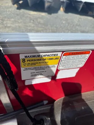 Slide: The Image of 2017 Tracker Bass Buggy 18 DLX capacity label, 8 persons or 1200 lbs limit. - 10