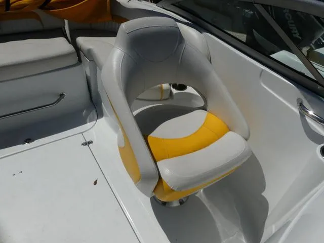 Slide: The Image of 2011 SouthWind 2400 Bowrider boat interior with yellow and white seating. - 10