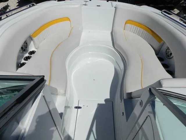 Slide: The Image of 2011 SouthWind 2400 Bowrider boat interior with white and yellow seating. - 12