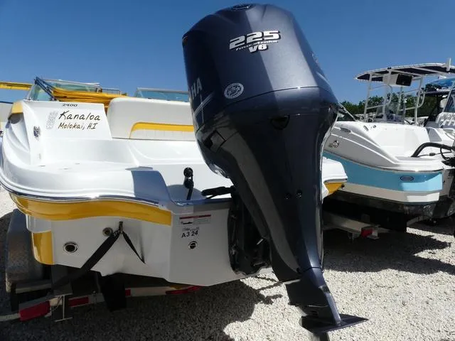 Slide: The Image of 2011 SouthWind 2400 Bowrider with Yamaha 225 V6 outboard motor, parked on gravel. - 3