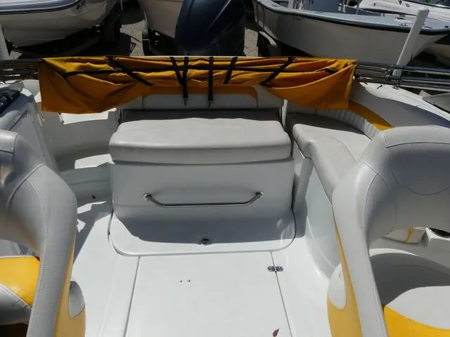 Slide: The Image of 2011 SouthWind 2400 Bowrider interior with white and yellow seating, showcasing spacious design. - 9