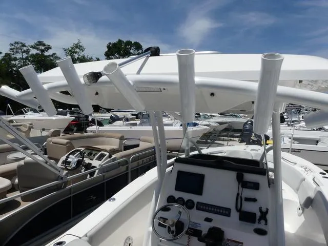 Slide: The Image of 2019 Sea Fox 266 Commander boat dashboard with rod holders and navigation equipment. - 15