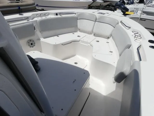 Slide: The Image of 2019 Sea Fox 266 Commander boat interior with white seating and cup holders. - 18