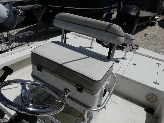 Slide: The Image of Boat interior with steering wheel and cushioned seat, Mako 21 LTS, 2017 model. - 11