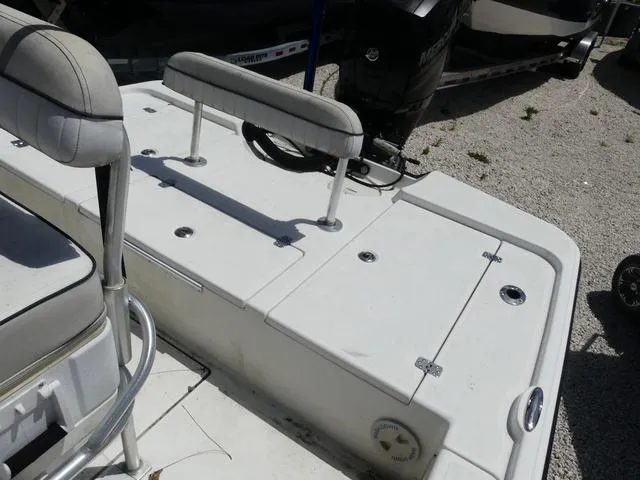 Slide: The Image of 2017 Mako 21 LTS boat deck with seating and storage compartments. - 12