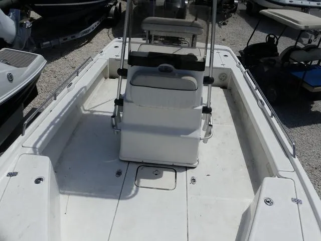 Slide: The Image of 2017 Mako 21 LTS boat interior with center console and seating. - 13