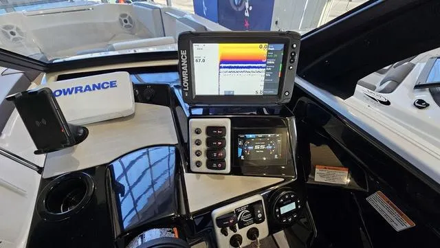 Slide: The Image of 2023 Yamaha Boats AR 220 dashboard with Lowrance navigation system and controls. - 15