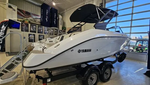 Slide: The Image of 2023 Yamaha Boats AR 220 displayed in showroom, featuring sleek design and modern amenities. - 3