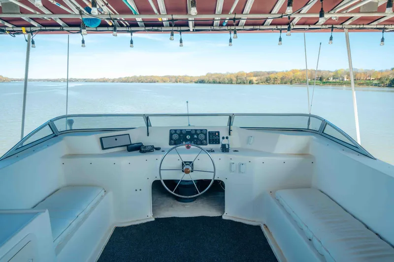 Slide: The Image of 1999 Sumerset houseboat helm with panoramic lake view and comfortable seating. - 24
