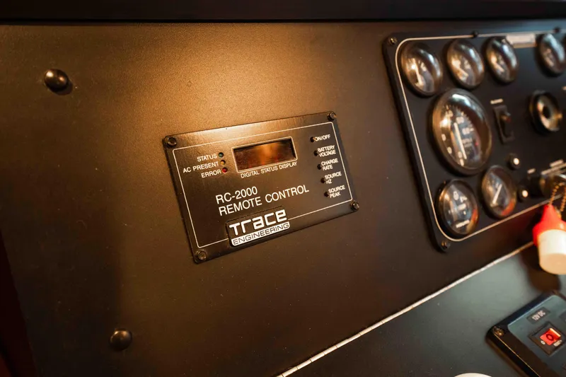 Slide: The Image of Control panel of a 1999 Sumerset houseboat featuring RC-2000 remote control and gauges. - 34
