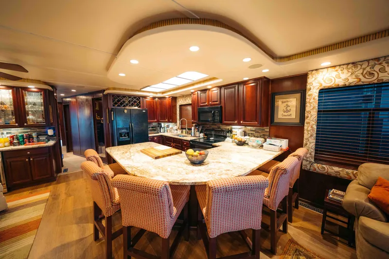 Slide: The Image of Luxurious 1999 Sumerset houseboat kitchen with elegant dining area and modern appliances. - 43