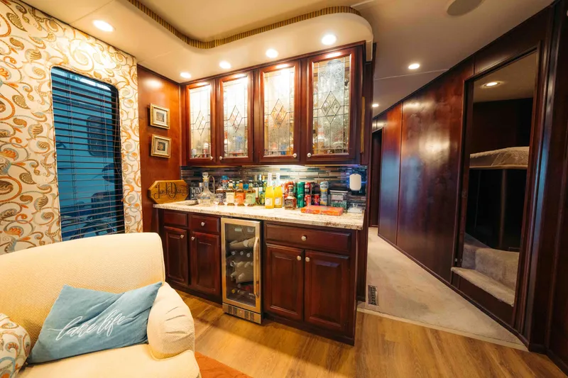 Slide: The Image of Luxurious 1999 Sumerset houseboat interior with elegant cabinetry and cozy living space. - 45