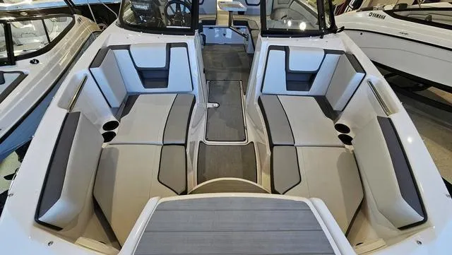 Slide: The Image of 2023 Yamaha Boats AR 220 interior with spacious seating and modern design. - 18