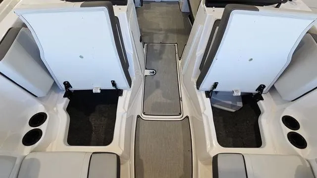 Slide: The Image of 2023 Yamaha Boats AR 220 interior seating and storage compartments. - 21
