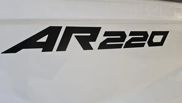 Slide: The Image of 2023 Yamaha Boats AR 220 logo on white surface. - 27