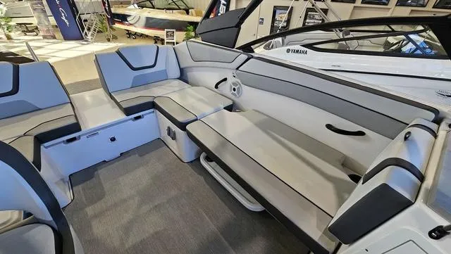 Slide: The Image of 2023 Yamaha Boats AR 220 interior with spacious seating and modern design. - 9