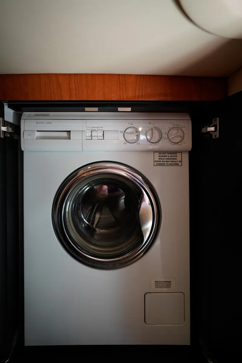 Slide: The Image of Washing machine inside 2000 Sea Ray 510 Sundancer yacht, compact and efficient design. - 14