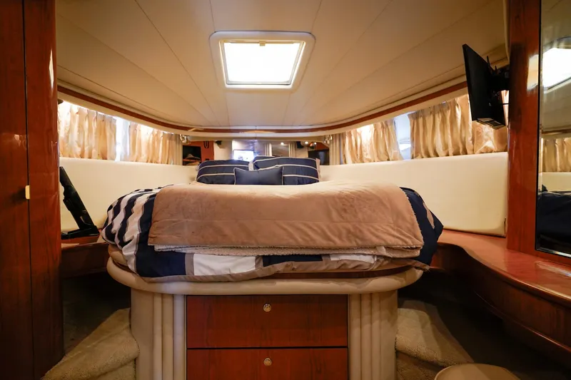 Slide: The Image of Luxurious interior cabin of 2000 Sea Ray 510 Sundancer yacht with cozy bedding. - 16