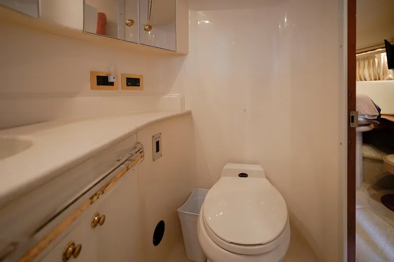 Slide: The Image of Bathroom interior of 2000 Sea Ray 510 Sundancer yacht, featuring modern amenities. - 19