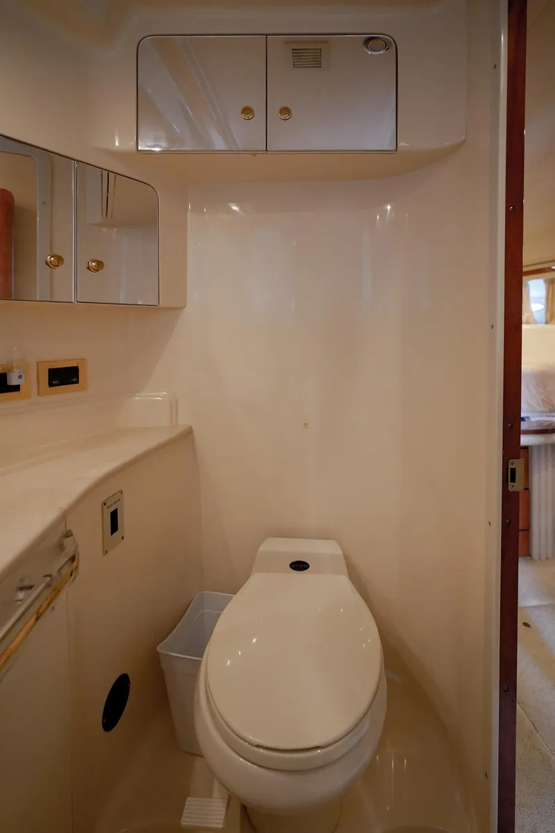 Slide: The Image of Bathroom interior of 2000 Sea Ray 510 Sundancer yacht, featuring modern fixtures and cabinetry. - 20