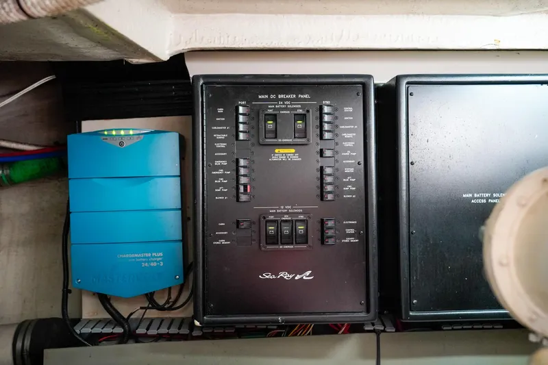 Slide: The Image of Electrical panel of a 2000 Sea Ray 510 Sundancer yacht, featuring control switches and wiring. - 37