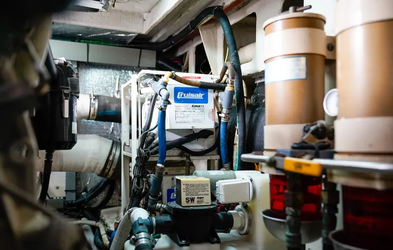 Slide: The Image of Engine room of 2000 Sea Ray 510 Sundancer with mechanical components and hoses. - 41