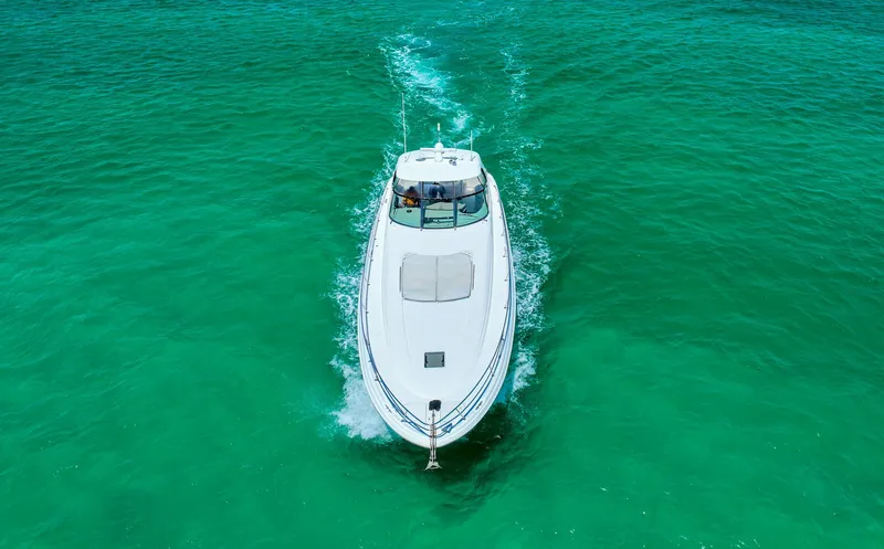 Slide: The Image of Sea Ray 510 Sundancer 2000 cruising on vibrant turquoise waters, aerial view. - 47