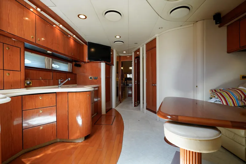 Slide: The Image of Luxurious interior of 2000 Sea Ray 510 Sundancer yacht with wood cabinetry and modern amenities. - 5